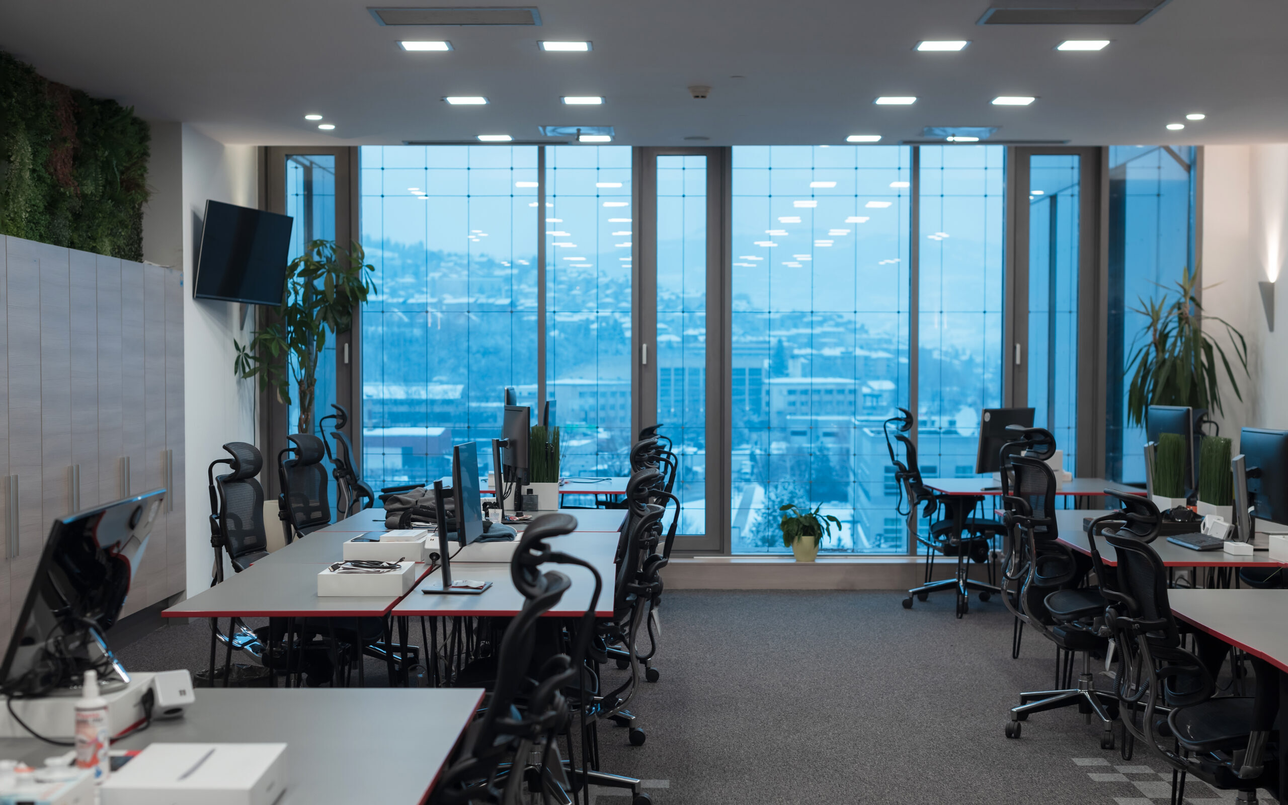 front view coworking office interior with workplaces blank picture frame wall computer1 1 scaled e1752532091618